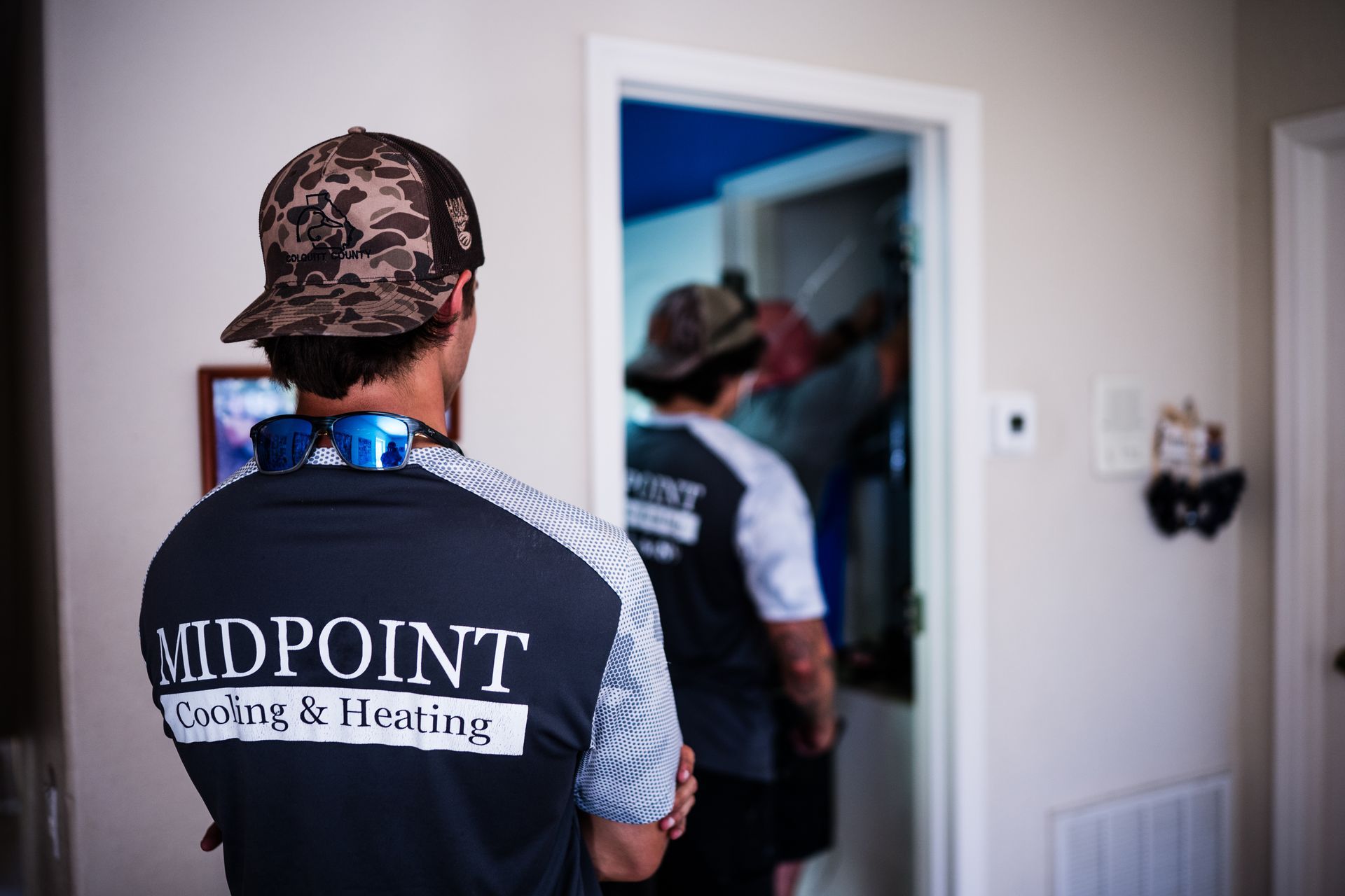 Midpoint Cooling & Heating technicians at a Fort Myers home