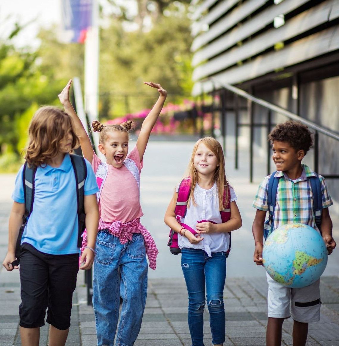 Group of happy children walking to school