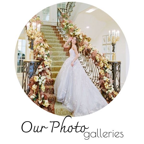 Bride in a white gown on a floral staircase beside “Our Photo galleries” text