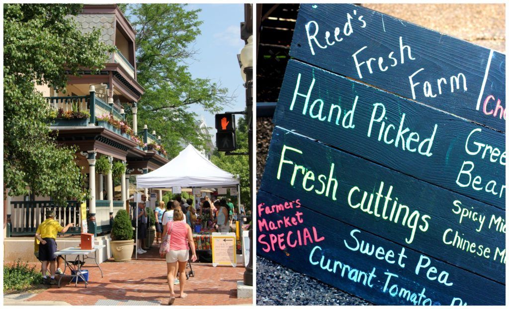 A woman is walking down a street next to a sign that says hand picked fresh cuttings