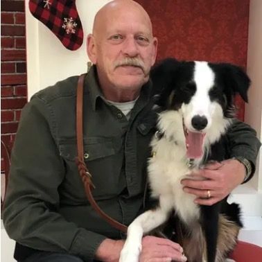 Jeramy Buckman with his dog, Anna