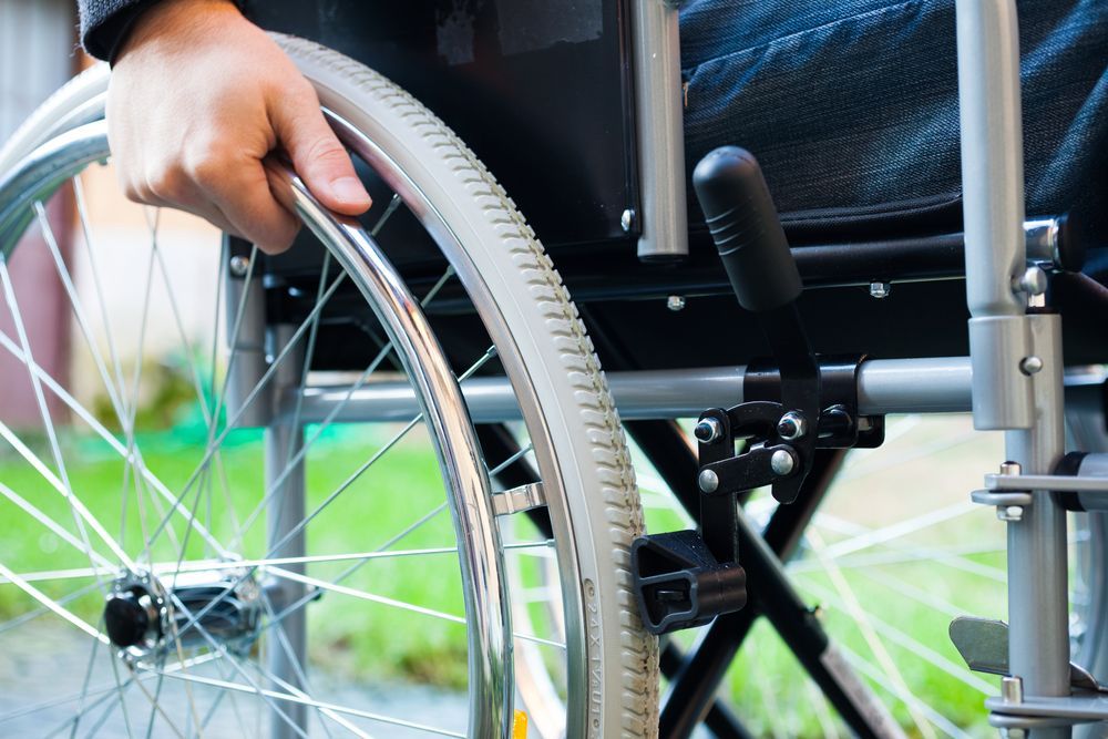 Man in the Wheelchair — Gold Coast Linen Hire in Tugun, QLD