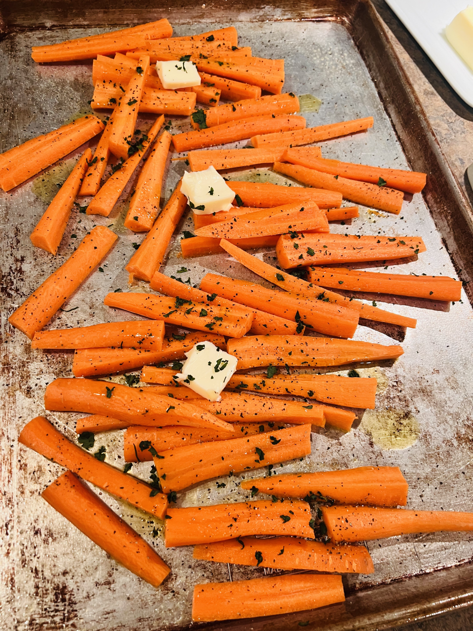 A Sheet Pan of Roasted Carrots With Butter. Honey Puddle Food & Farms Meal Prep in Hallsville, MO.