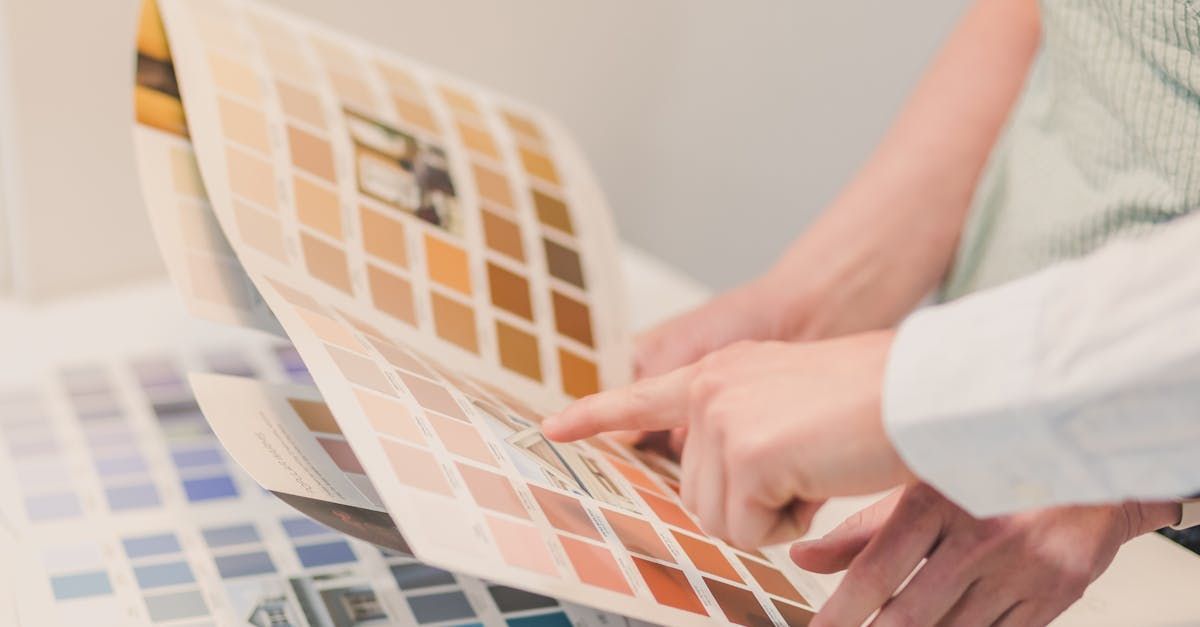 Hands pointing to colors on a color palette