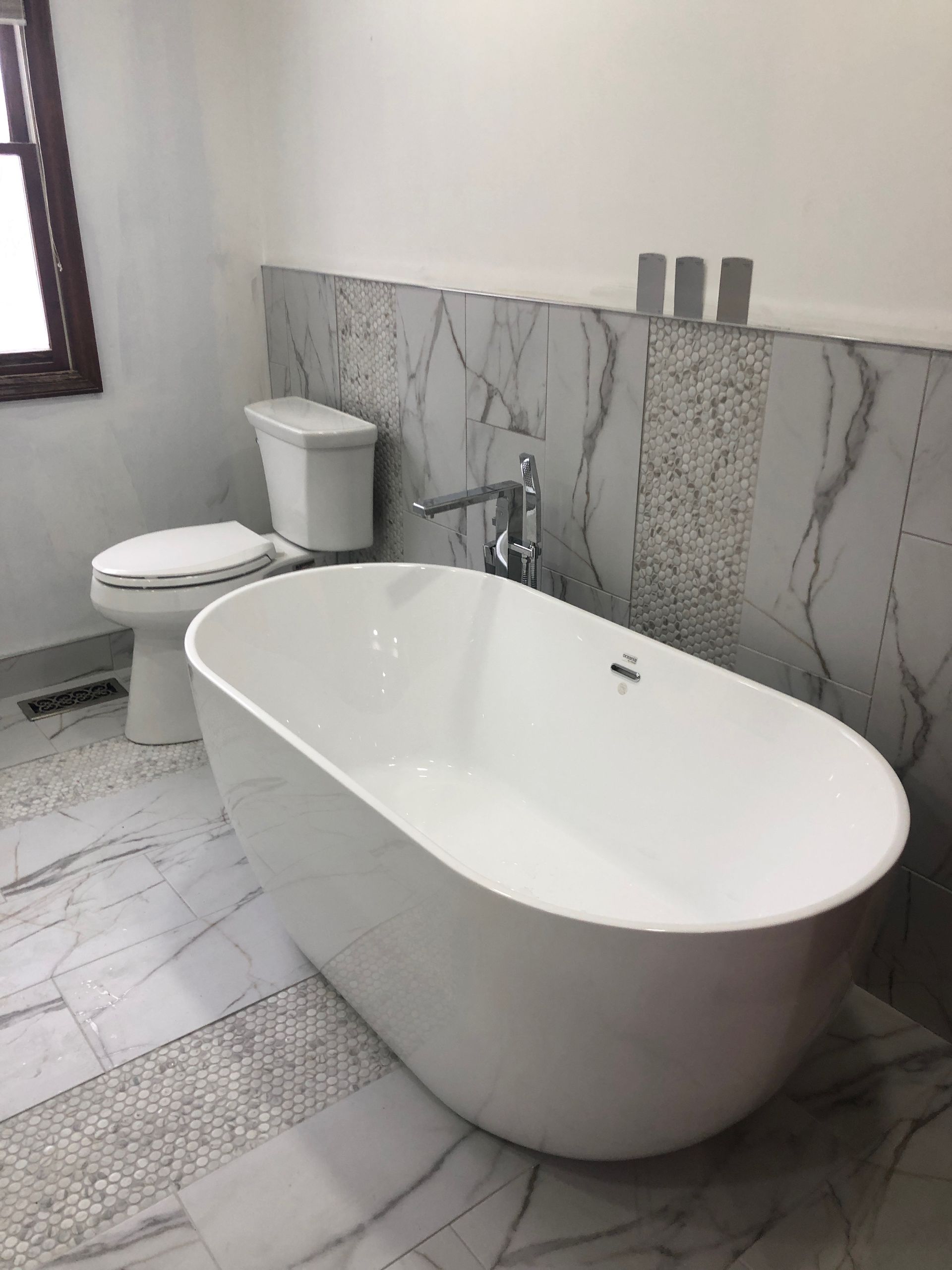 PLACEHOLDER — replace with real H2O photo of a finished faucet or vanity fixture installation in a residential bathroom.