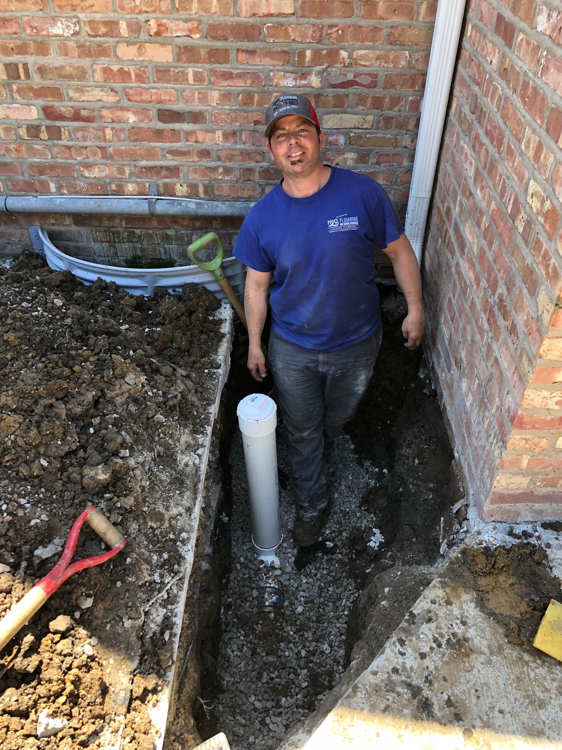 Owner, Todd, working on a job looking at the camera smiling