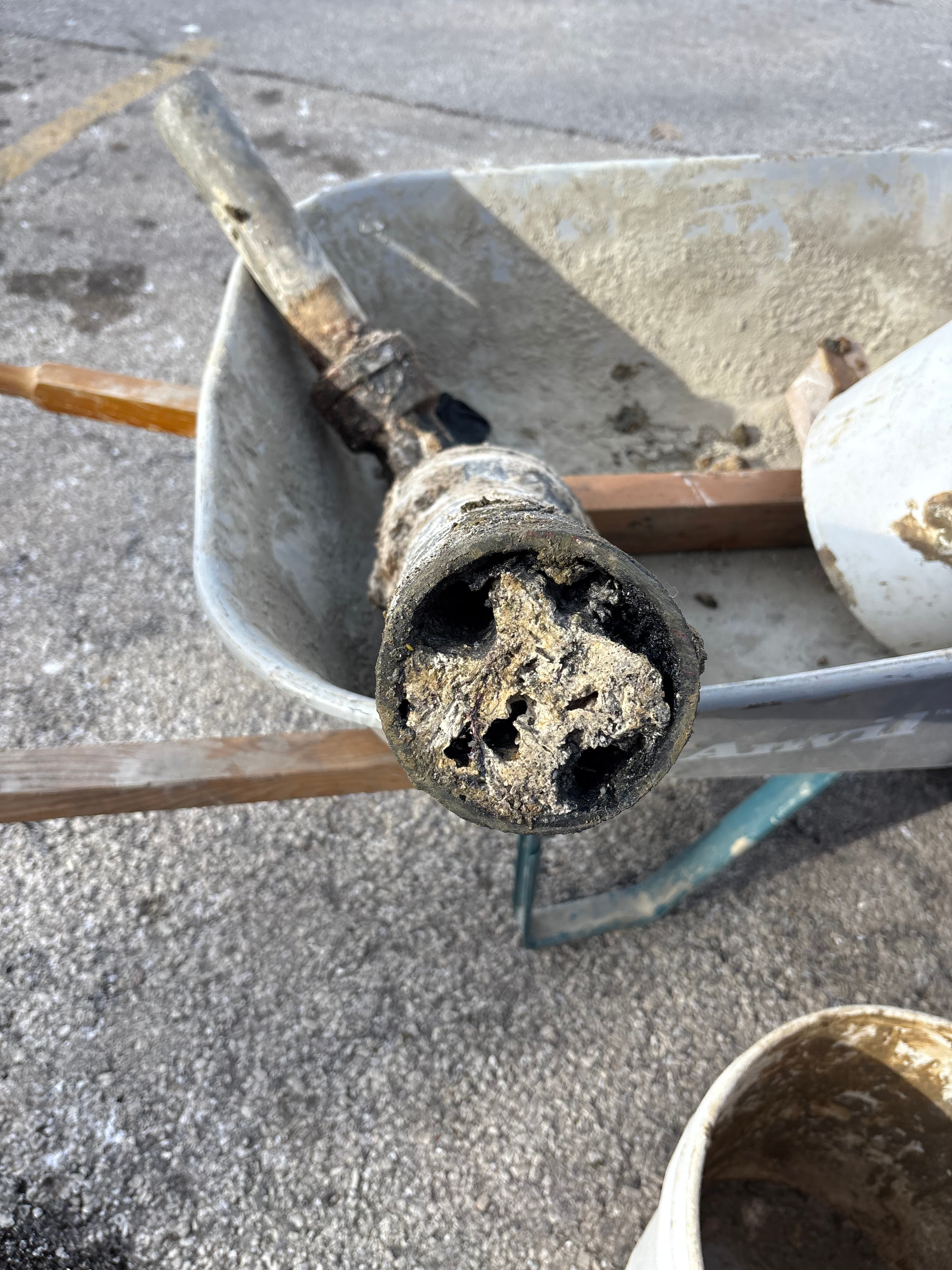 PLACEHOLDER — replace with real H2O technician clearing a drain line on a residential service call.