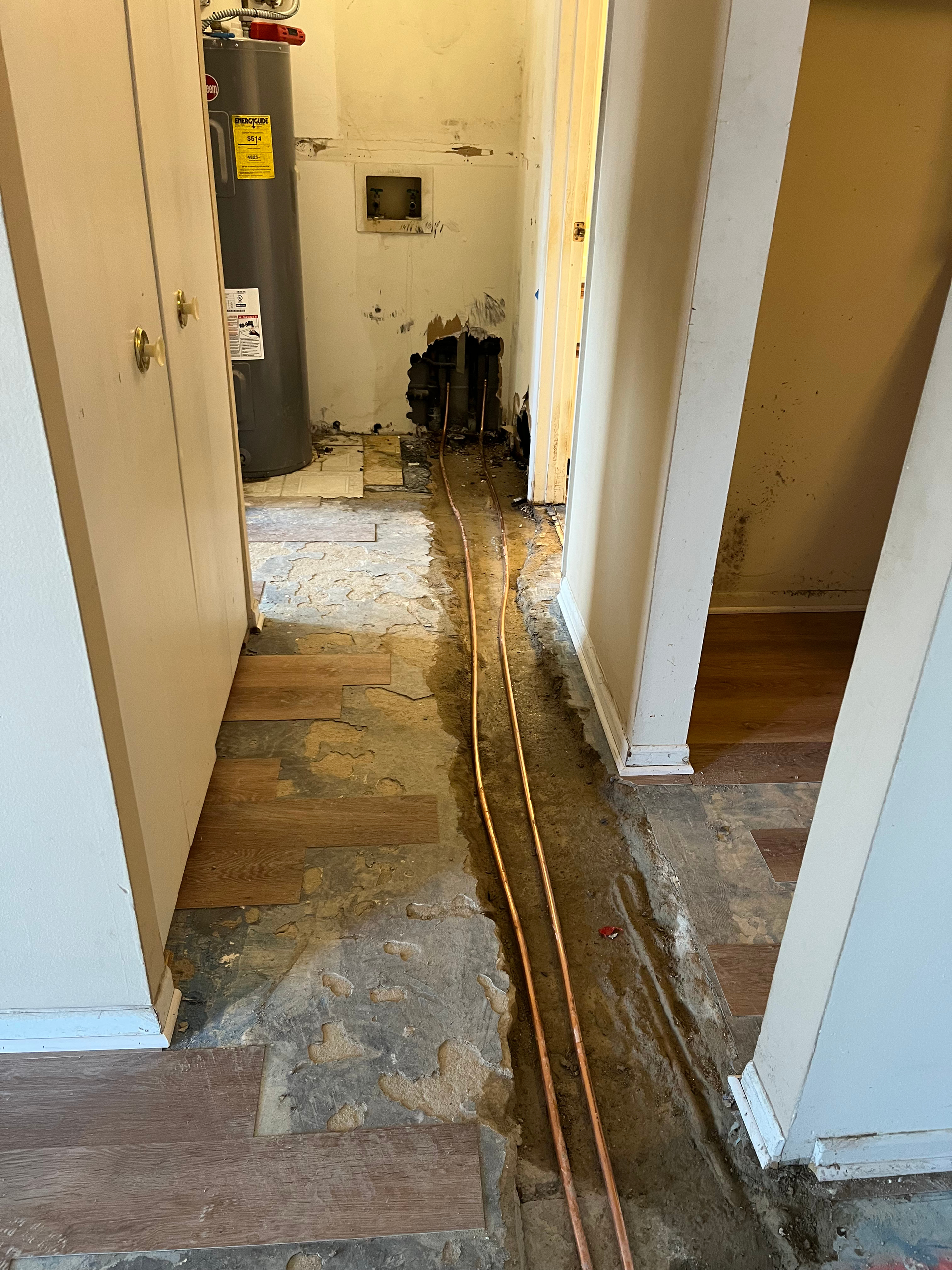 PLACEHOLDER — replace with real H2O job photo: plumber installing new copper or PEX piping during a residential repipe project.