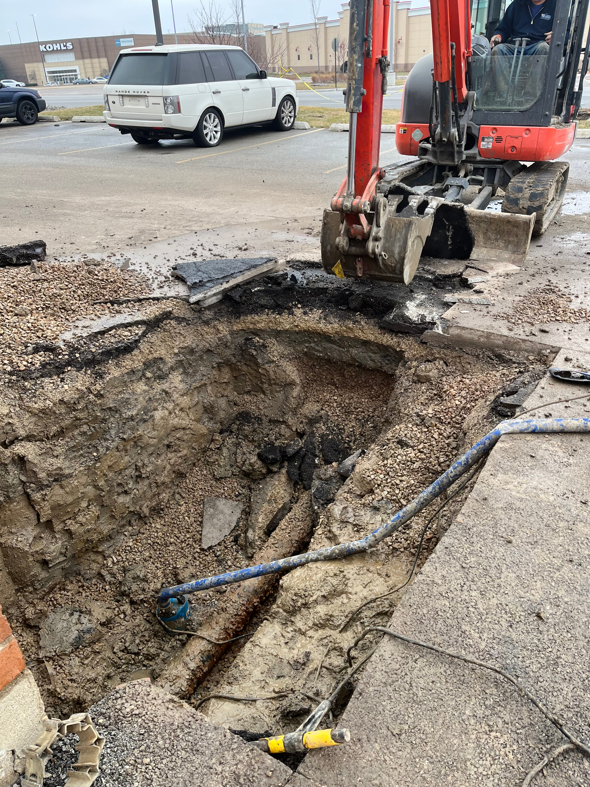 PLACEHOLDER — replace with real H2O job photo: corroded galvanized pipe removed during a repipe project alongside new copper replacement pipe.