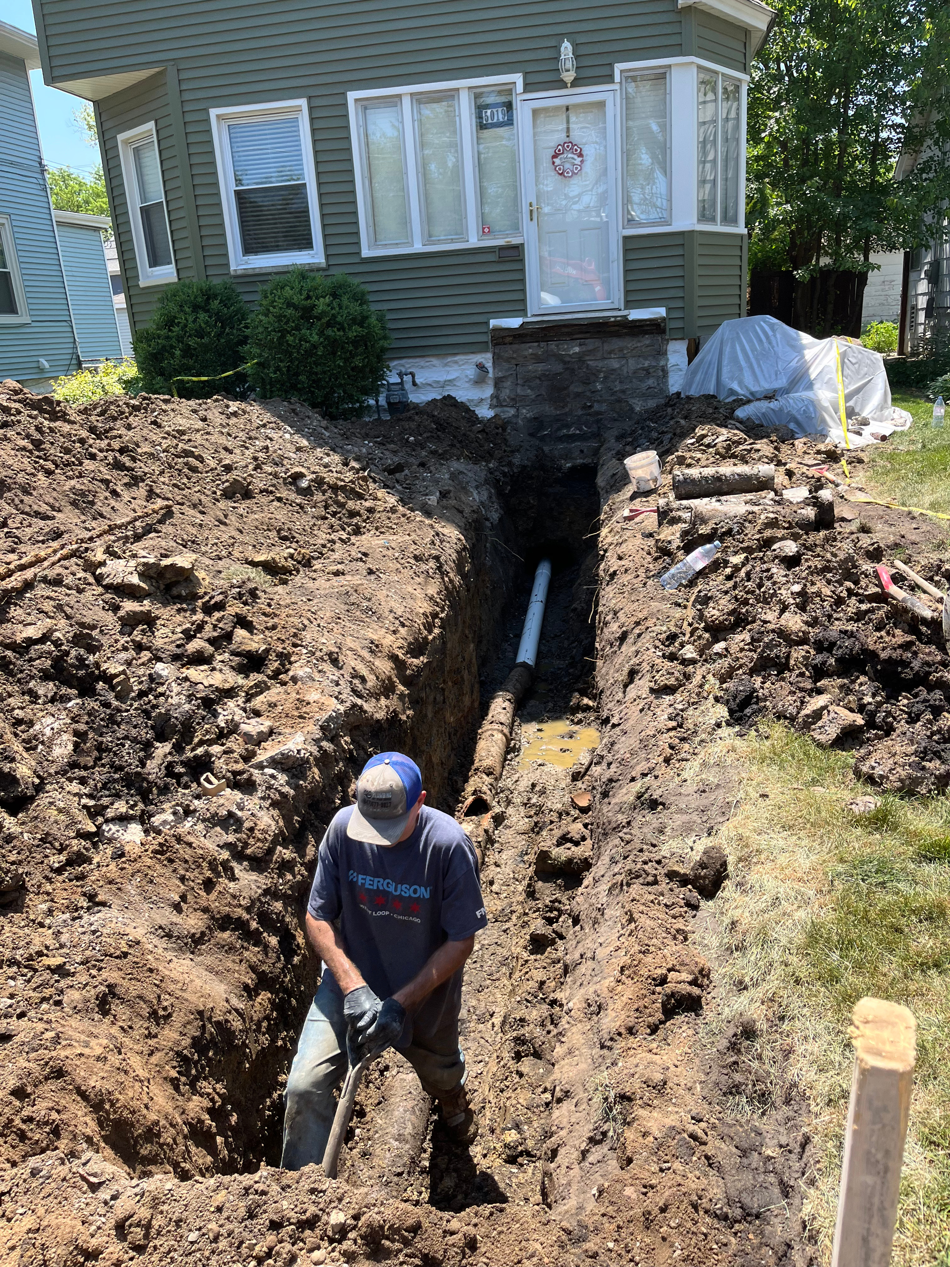 PLACEHOLDER — replace with real H2O photo showing a wet yard spot or drain backup symptom.