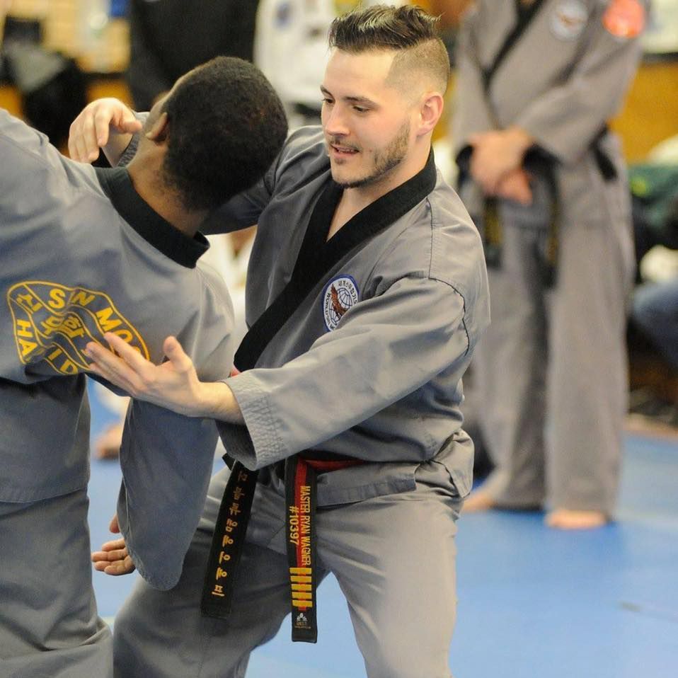 a man with a black belt that says master ron walker