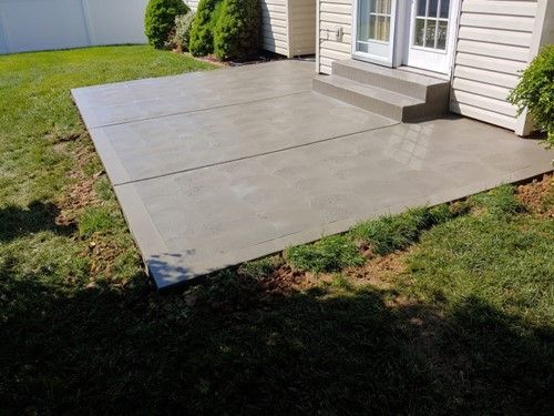 A Concrete Patio in Front of a House - Wentzville, MO - Nelson Concrete & Construction