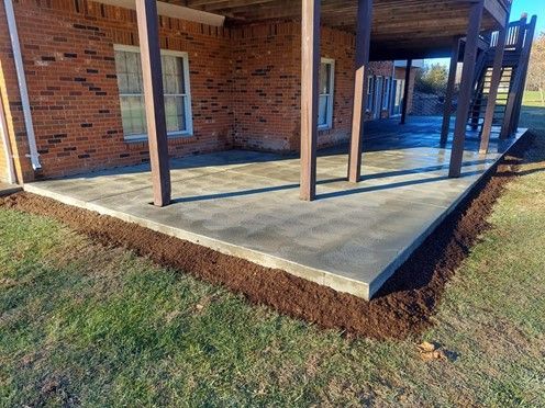 A Brick House With a Concrete Patio - Wentzville, MO - Nelson Concrete & Construction