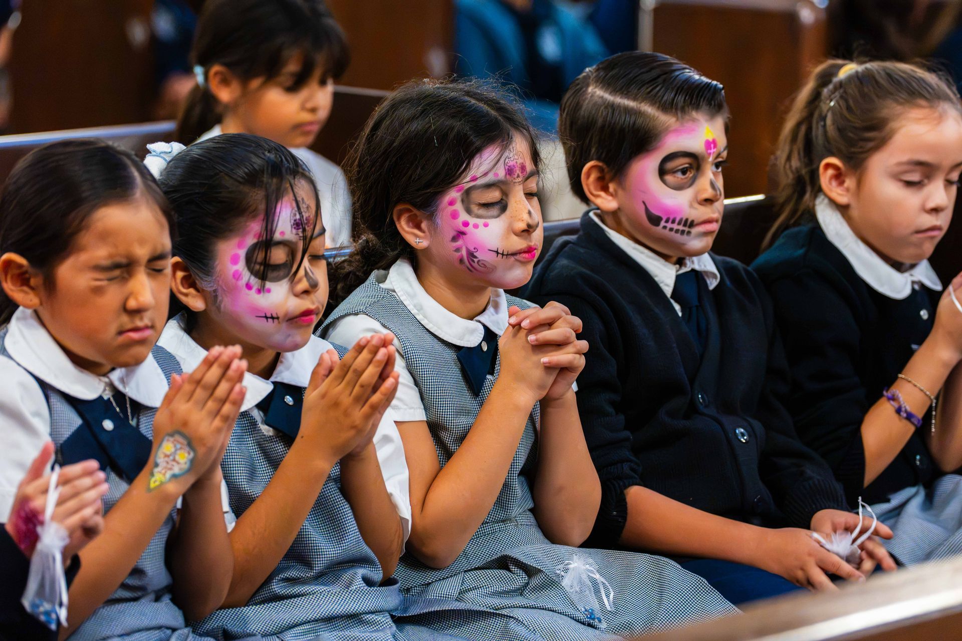 Catholic School children pray in Chapel | Día de los Muertos Catechetical Day 2026