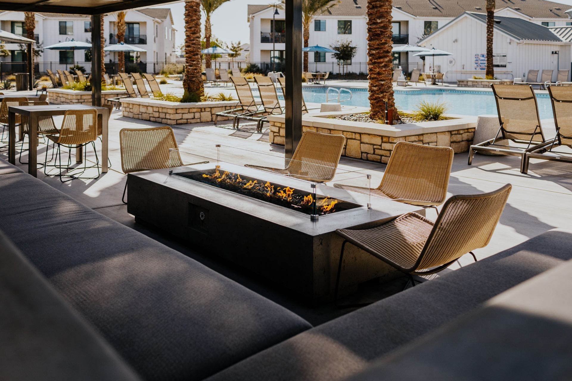 There is a fire pit in the middle of the patio.