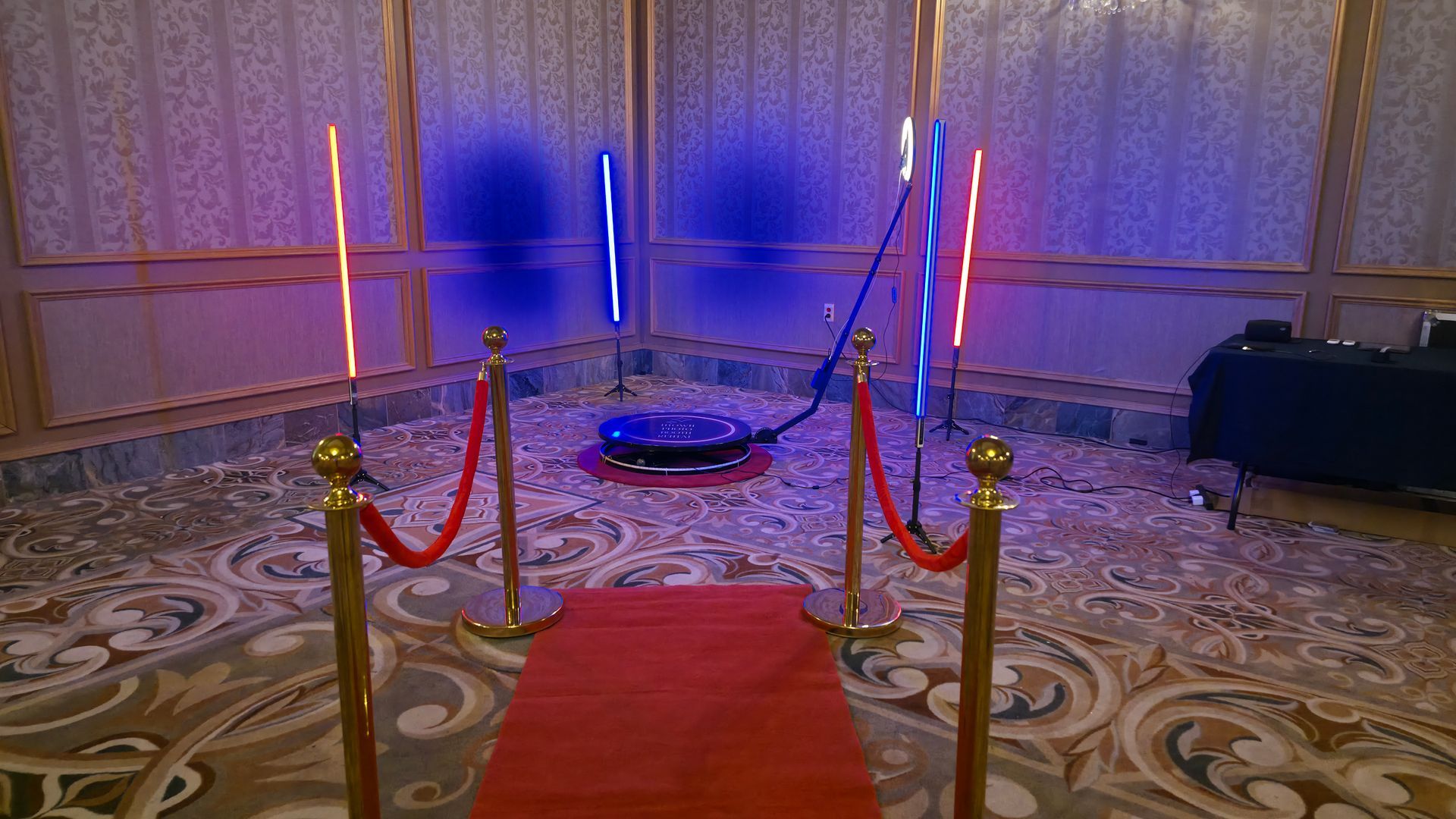 360 photo booth platform with LED lighting and VIP red carpet experience for events and parties