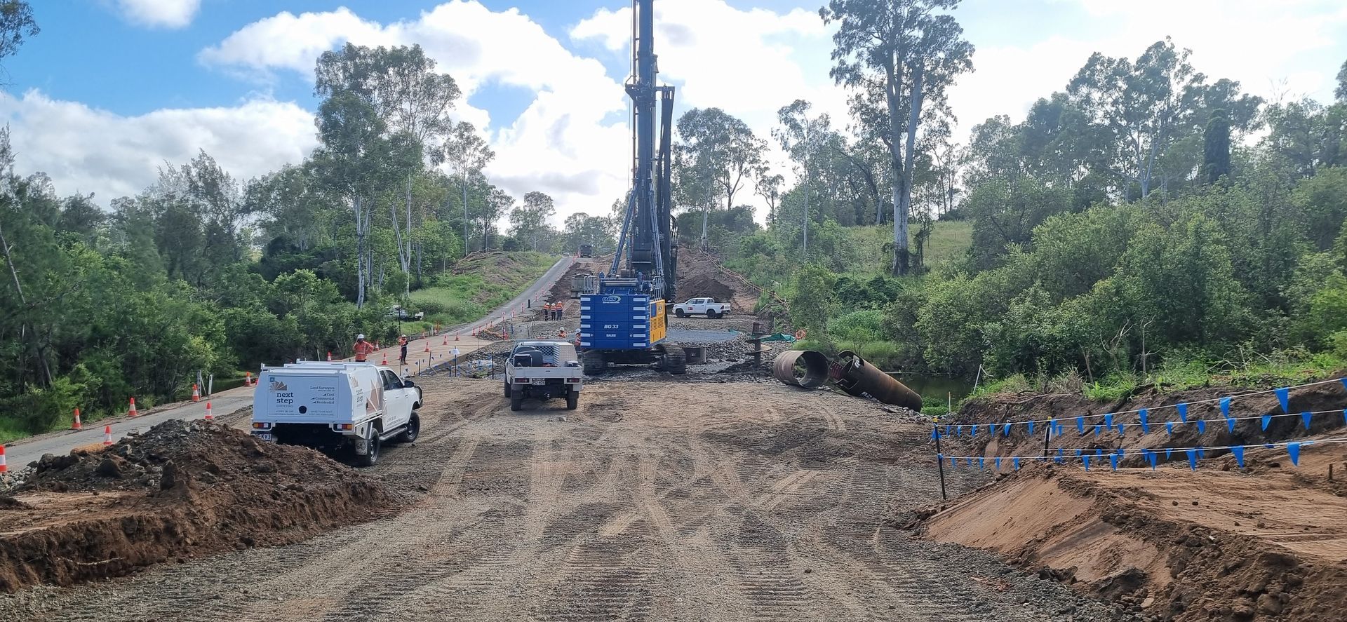Construction Site With Large Machinery and Trucks — Next Step Surveying in Toowoomba, QLD