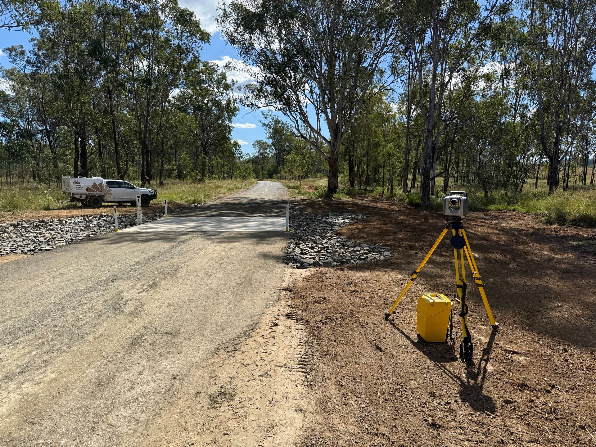 Survey Equipment Set Up on Dirt Road — Next Step Surveying in Caloundra, QLD