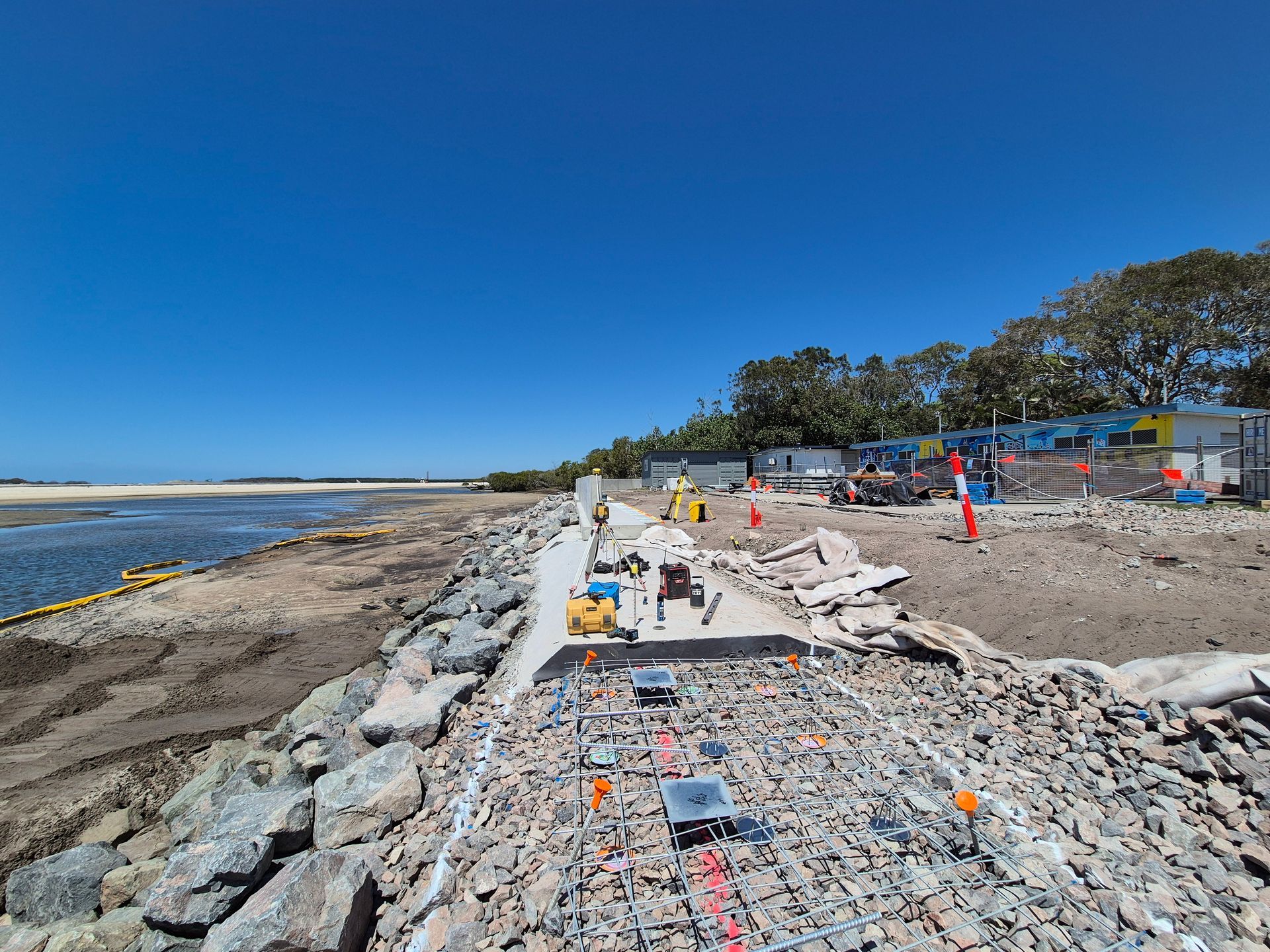 Construction Site Along a Beach With Debris — Next Step Surveying in Gympie, QLD