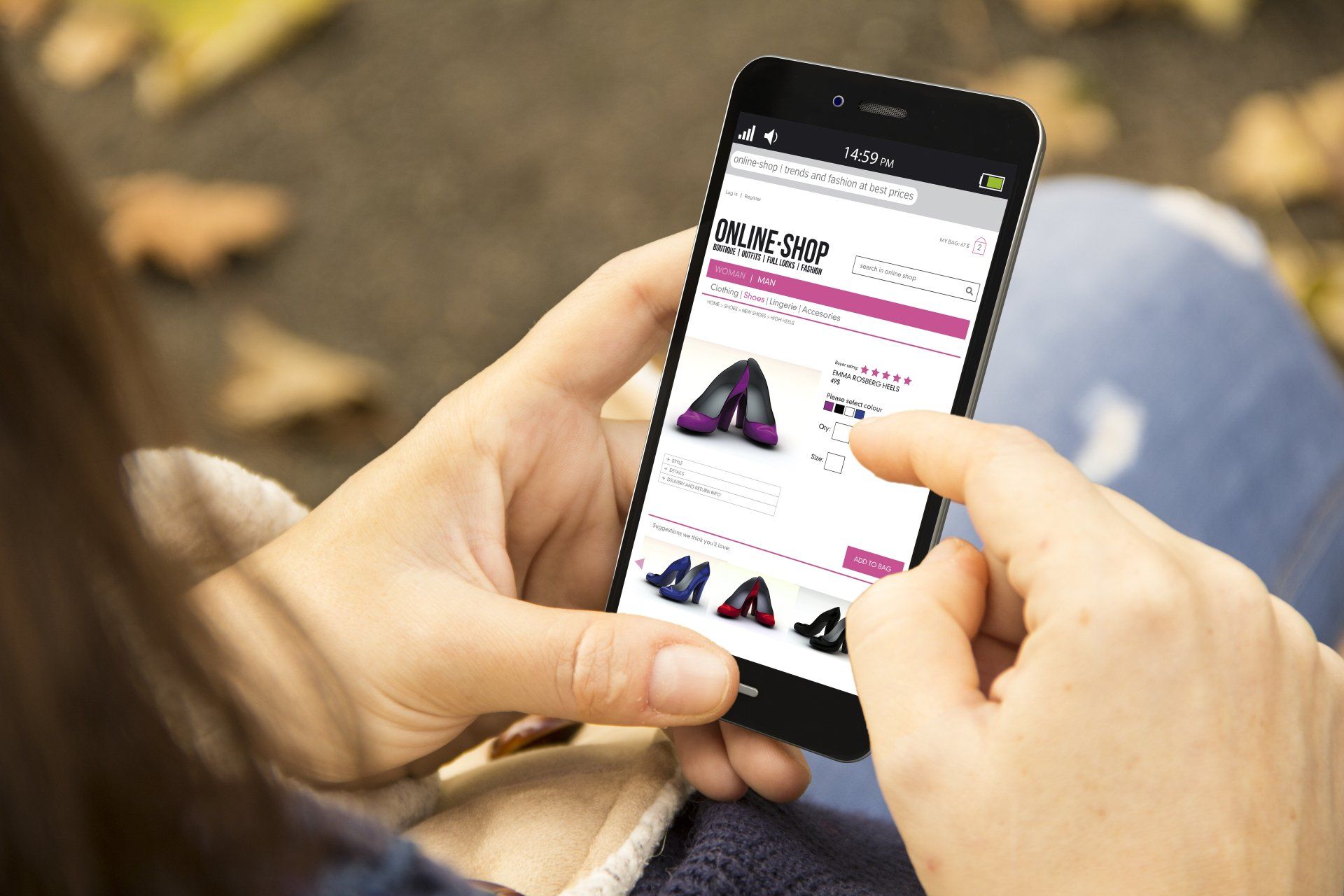 A woman is using a smart phone to shop for shoes