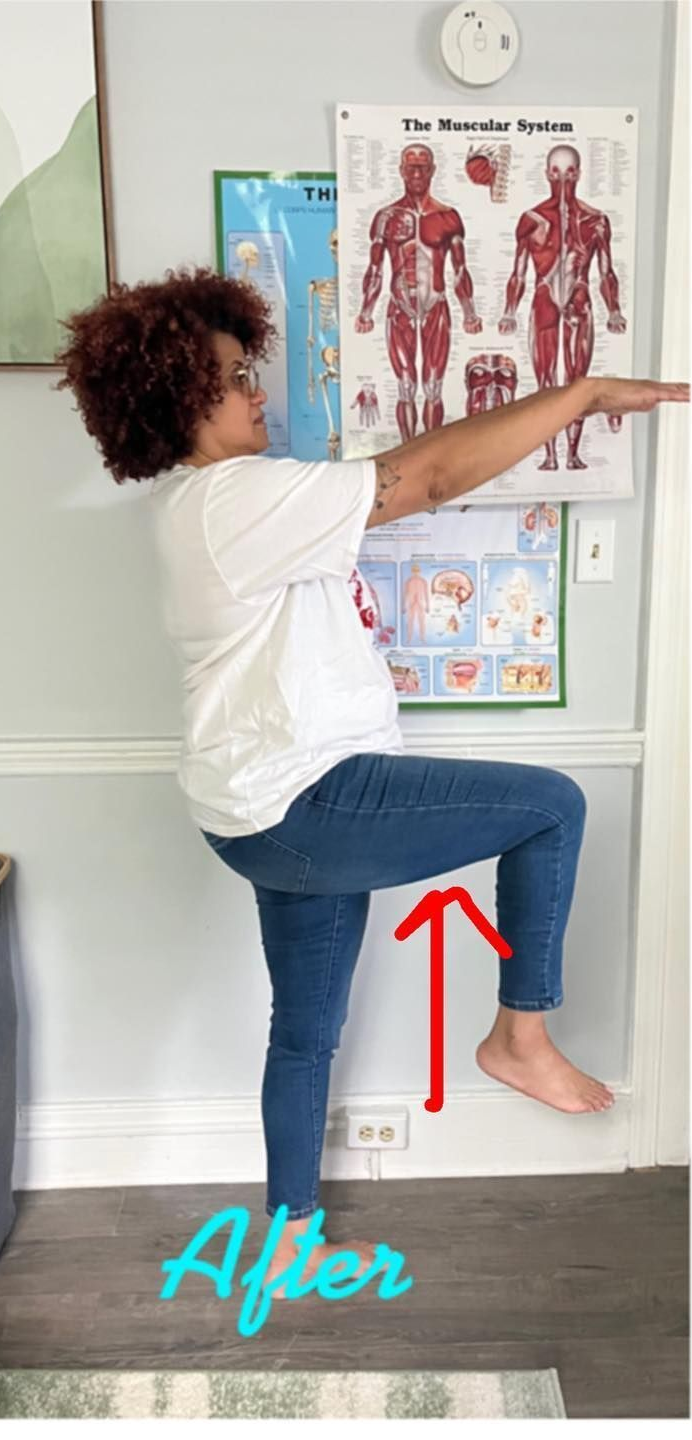 Person standing on one leg in a clinic, raising the knee to hip height, with a red arrow highlighting the movement.