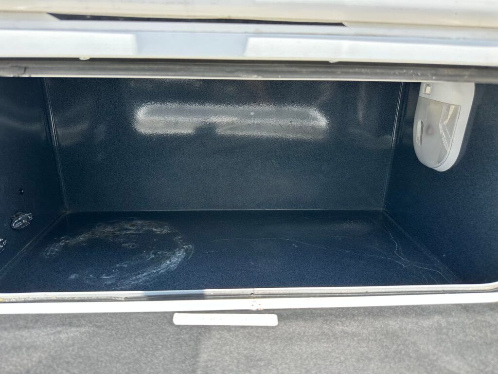A close up of the inside of an oven with a light coming out of it.