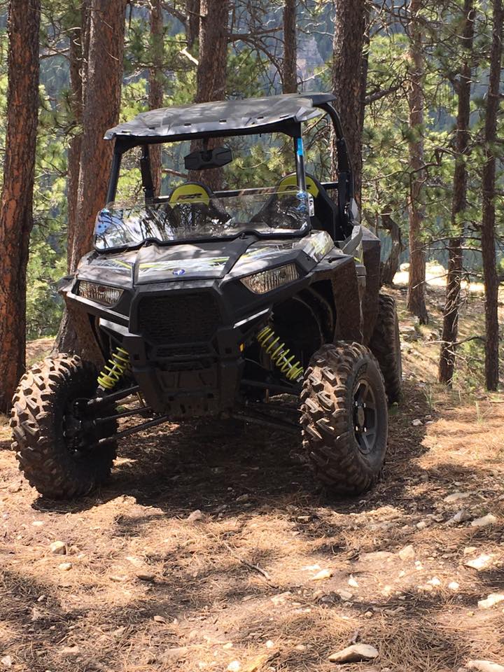 Parked muddy UTV