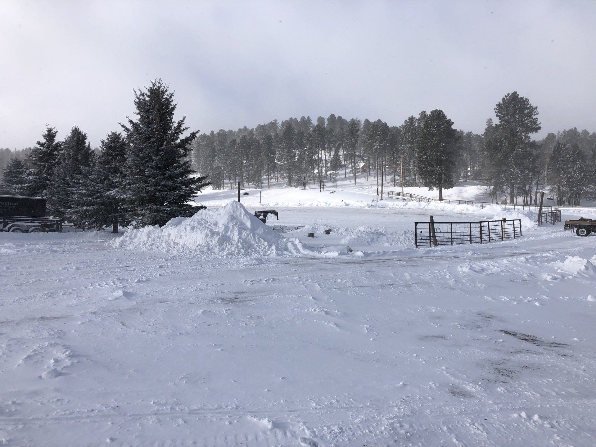 A family riding a snowmobile