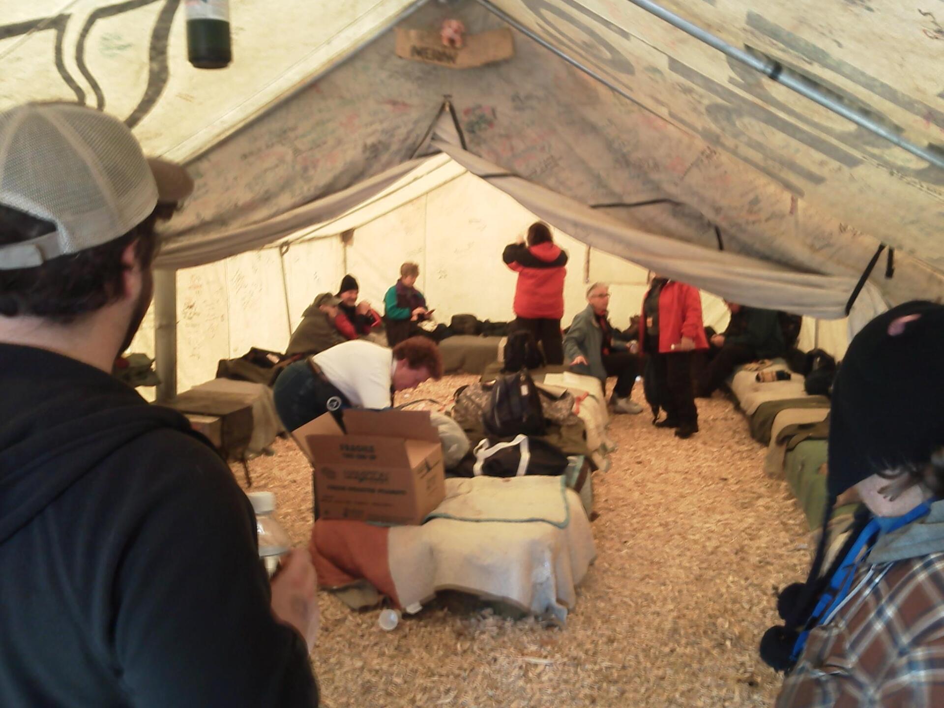 Group of people inside a tent