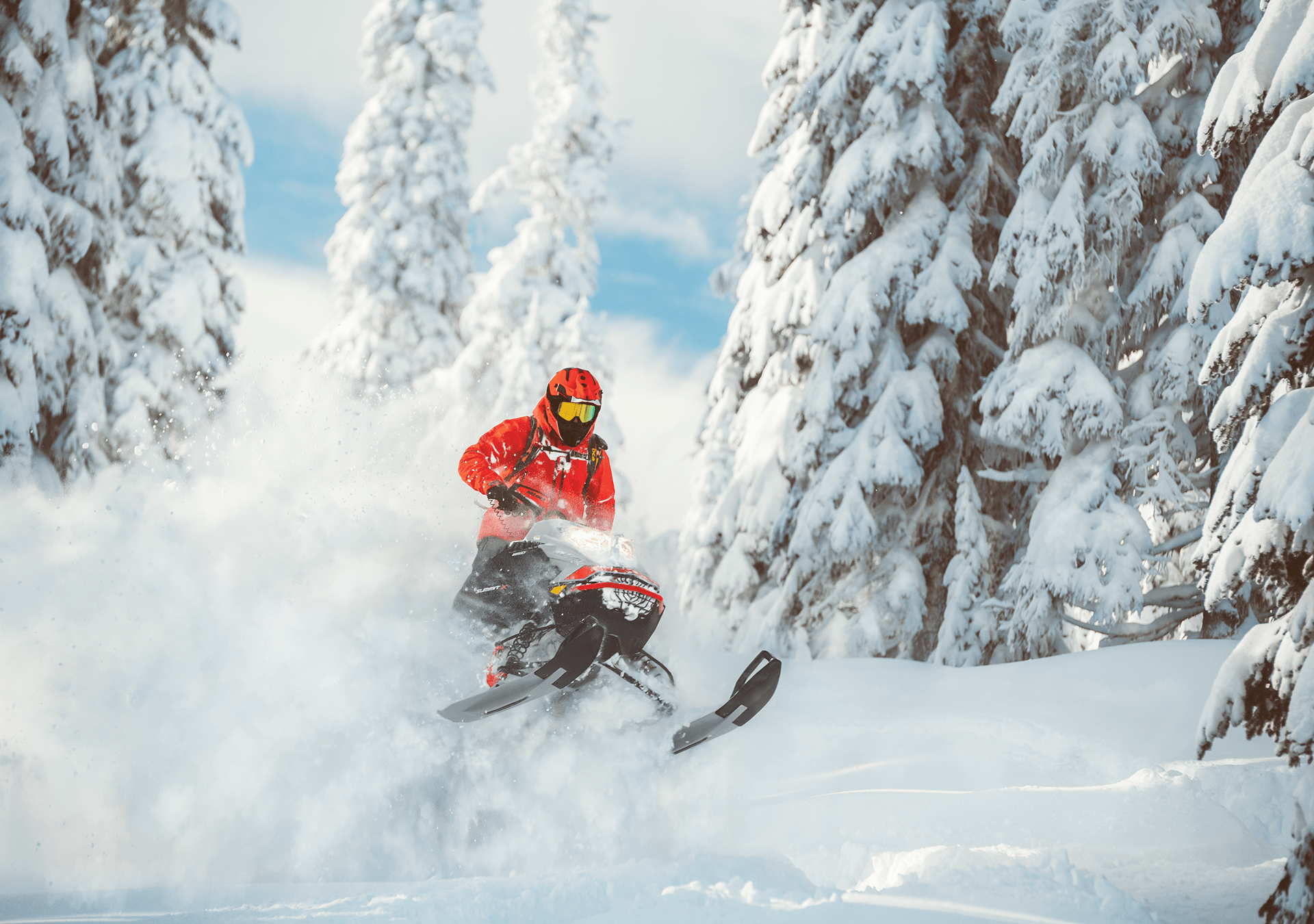 Professional snowmobile rider on a extreme trail