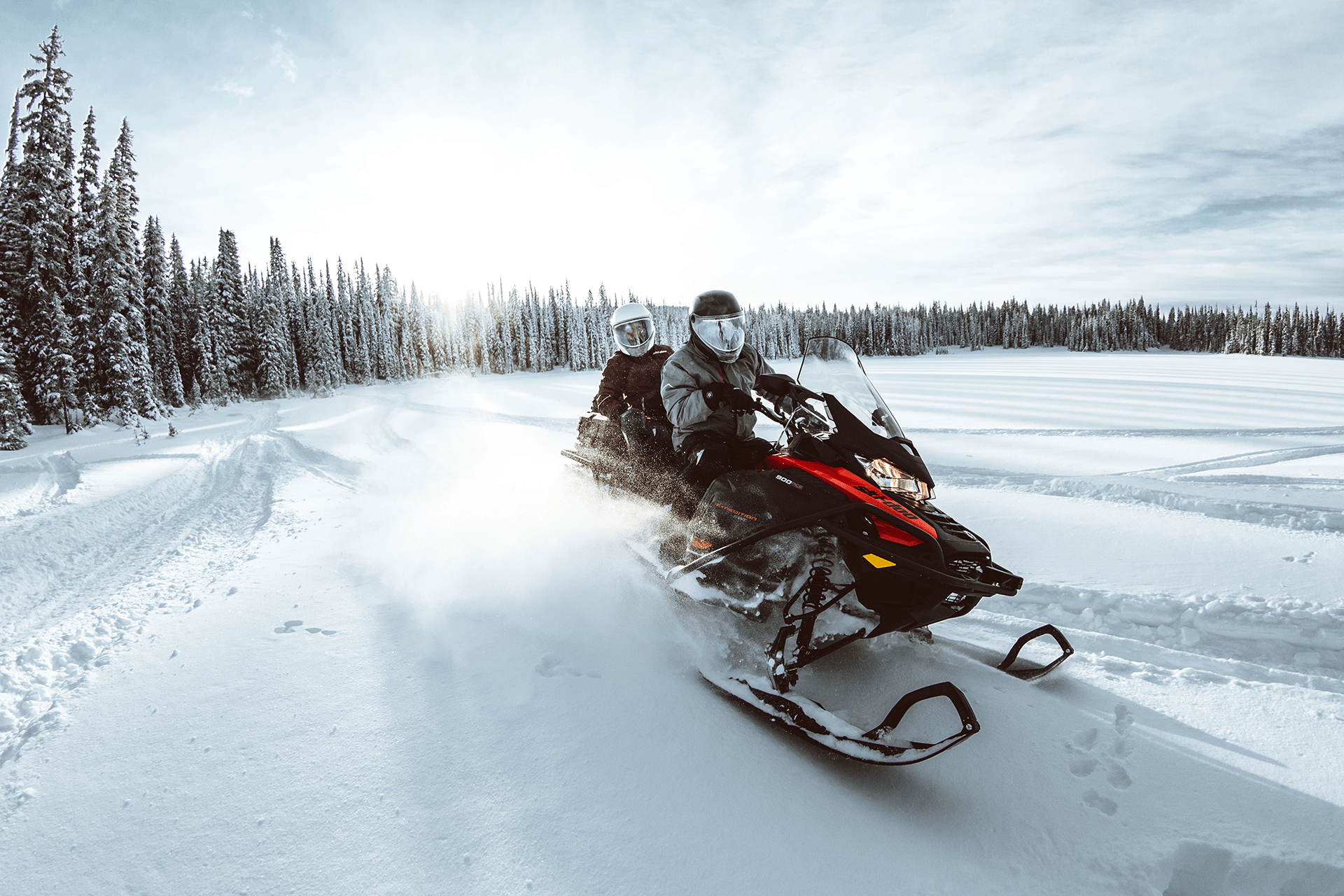 2-seater snowmobile on a field of snow