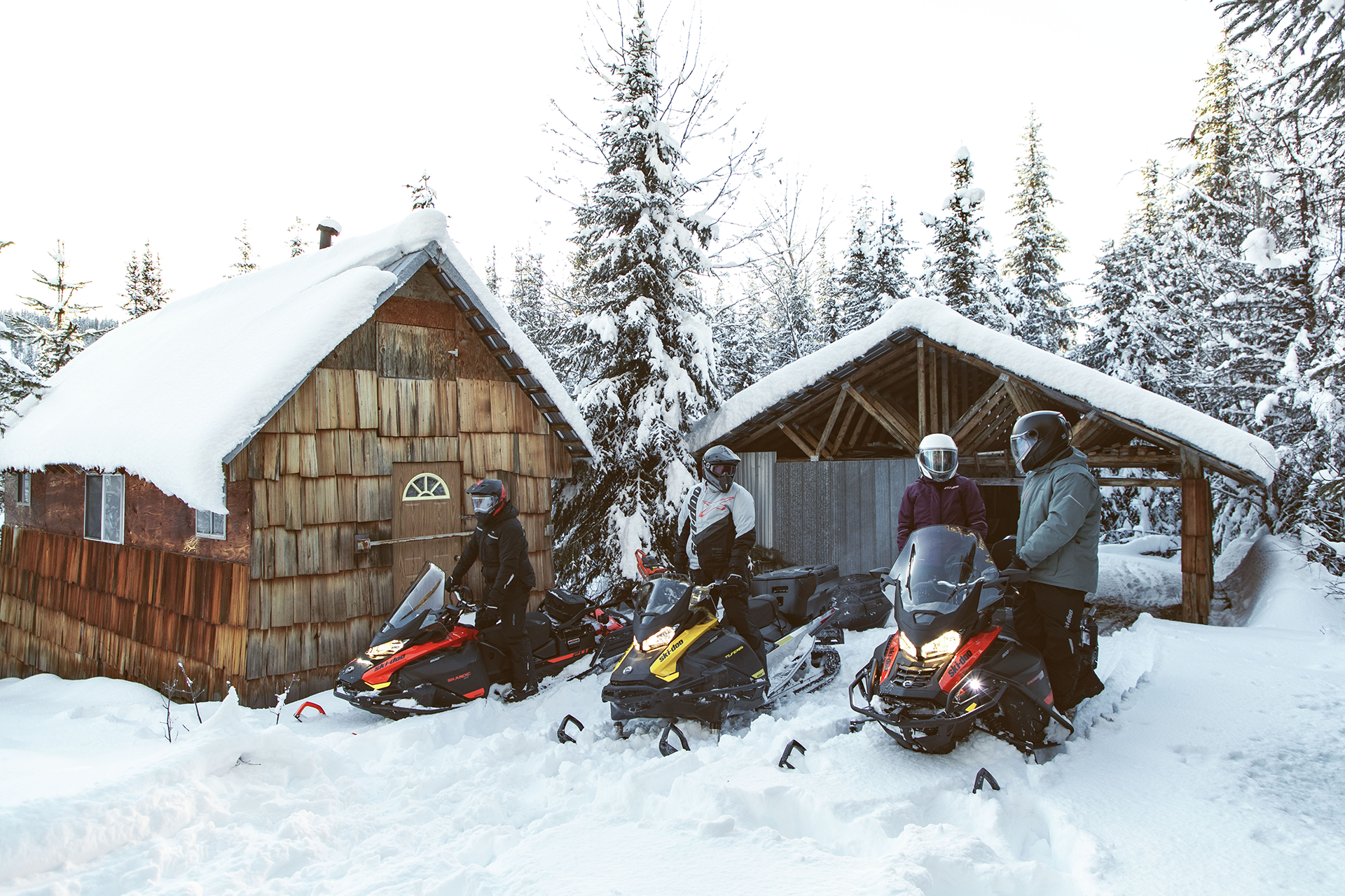 Group of people preparing to ride snowmobiles