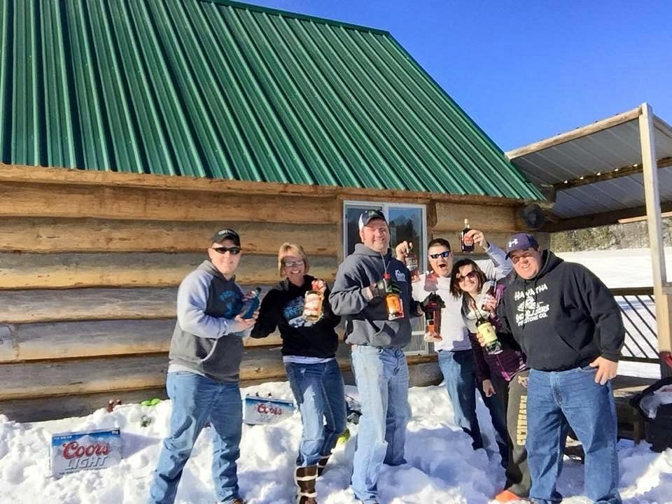 group of people standing in snow at event