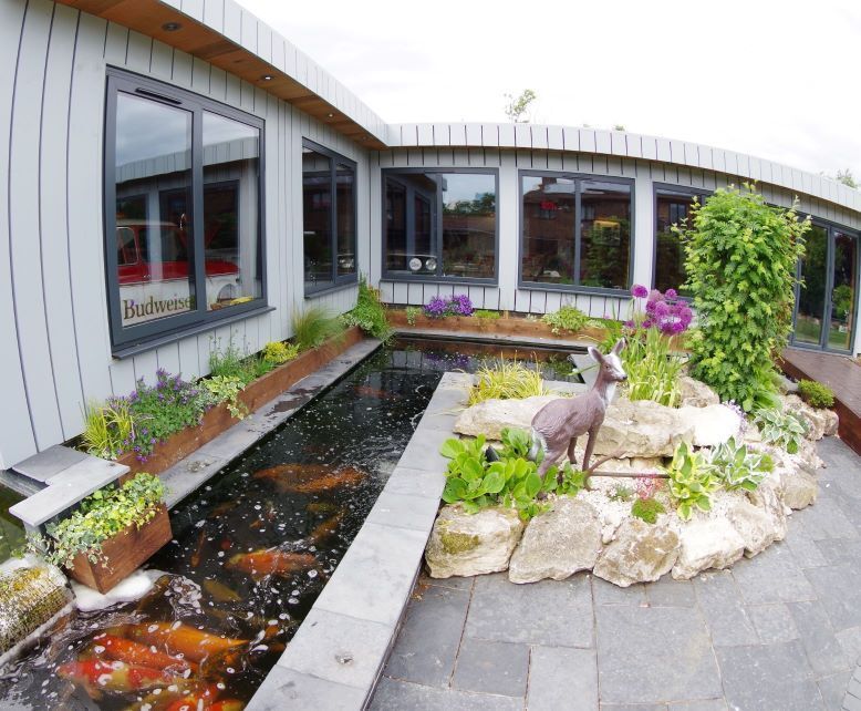 massive outdoor garden building and koi moat and landscaping by buildjunky.com