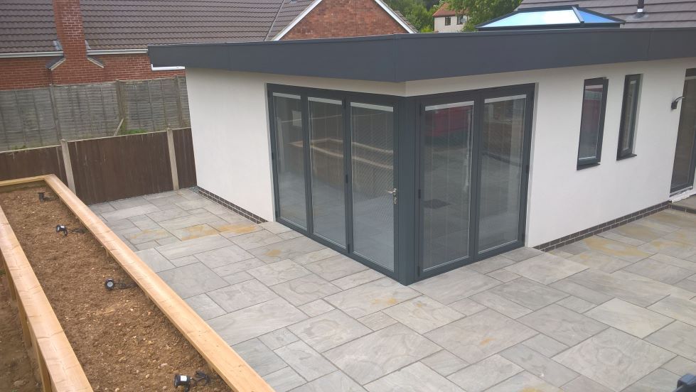 bungalow refurbishment new roof extension cement render finish underfloor heating large timber planter floating corner bi-folding doors