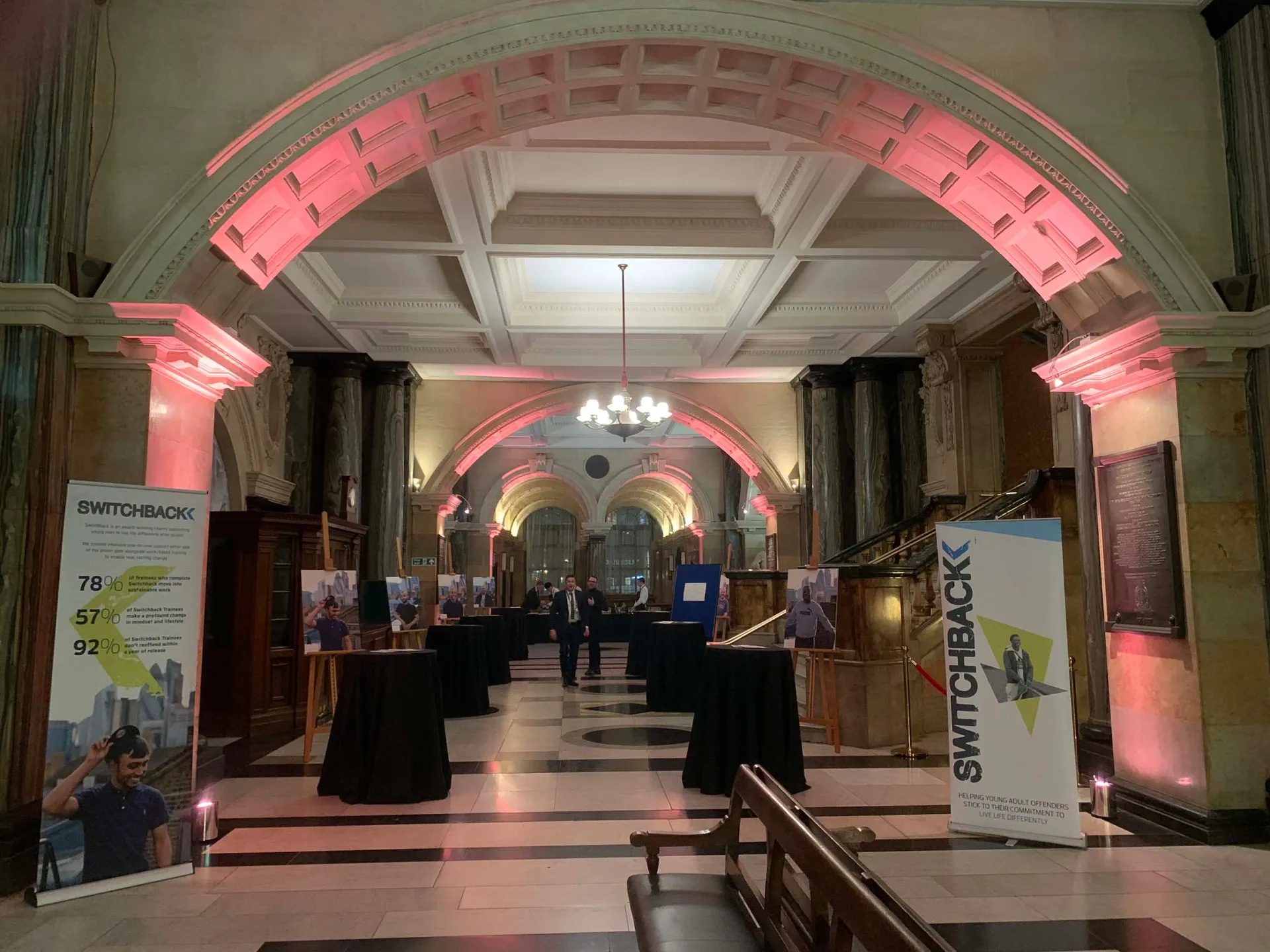 A large hallway with tables and banners supplied by Absolute Events