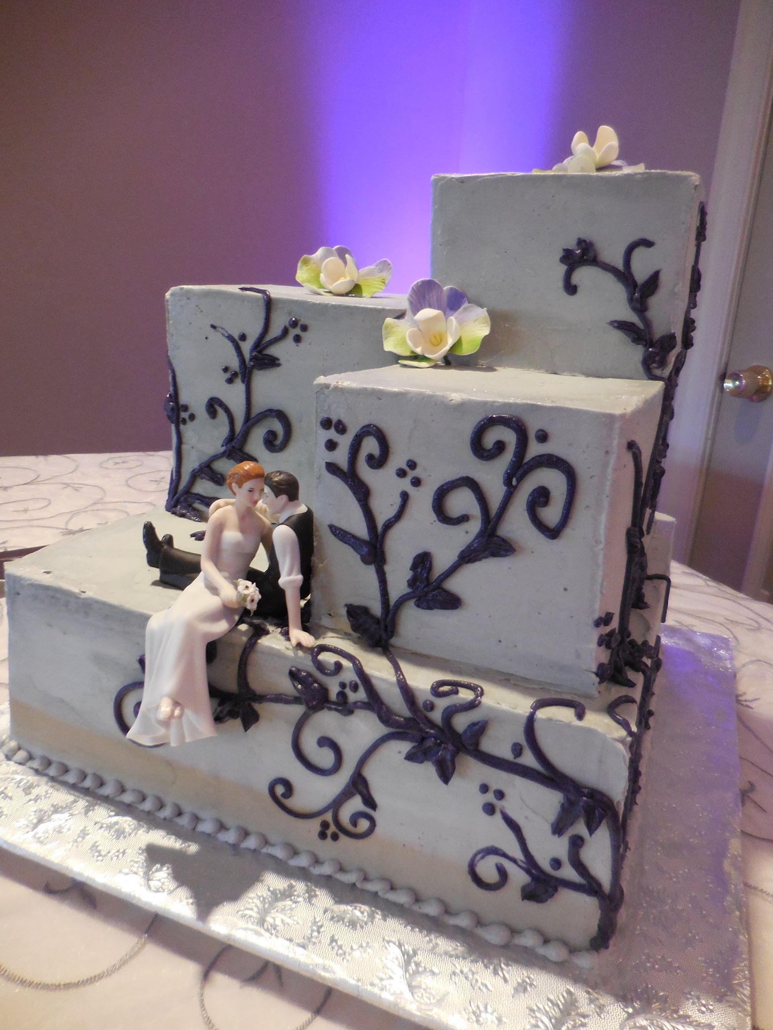 Wedding cake with man and woman leaning on each other — Hawley, PA — Sweet Sensation Cakes