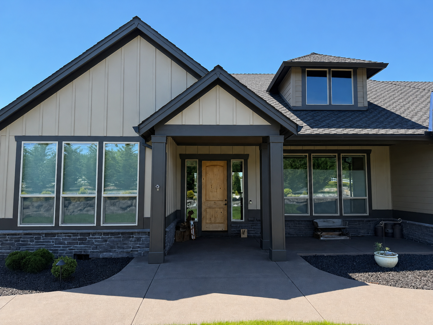 Luxury custom home entrance with a covered porch and Pacific Northwest design