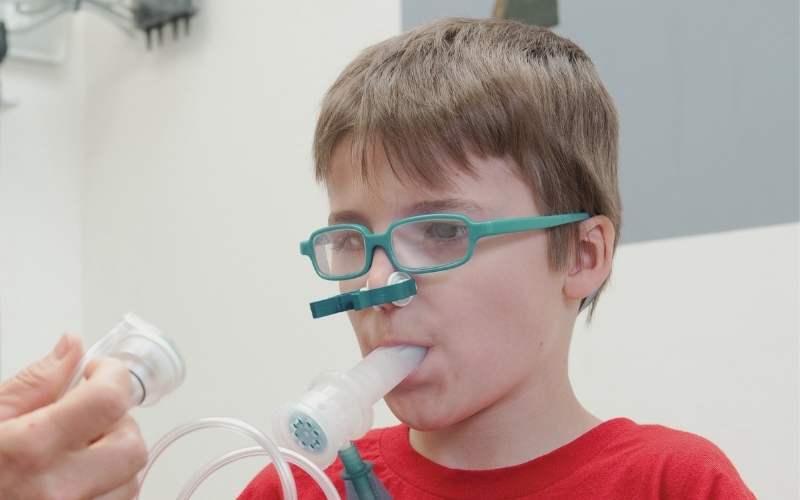A child with CF getting treatment