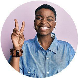 Woman holding up the number 2 with her hand