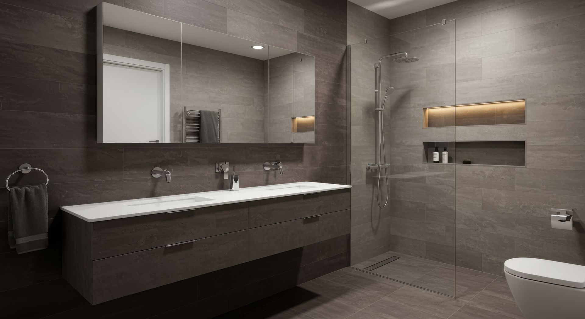 Modern bathroom with gray tile, floating vanity, large mirror, and glass shower. Modern bathroom with gray tile, floating vanity, large mirror, and glass shower.