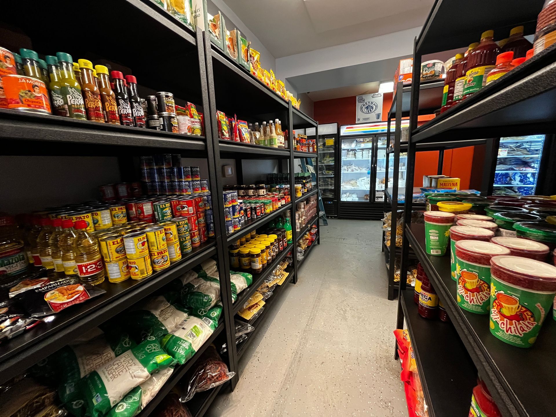 A grocery store aisle filled with lots of food items