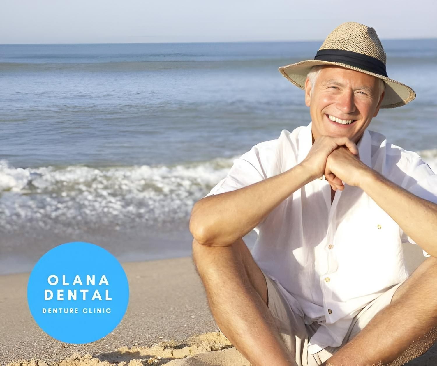 An Older Man Wearing A Straw Hat Is Sitting On The Beach — Miami Denture Clinic In Burleigh Heads, QLD