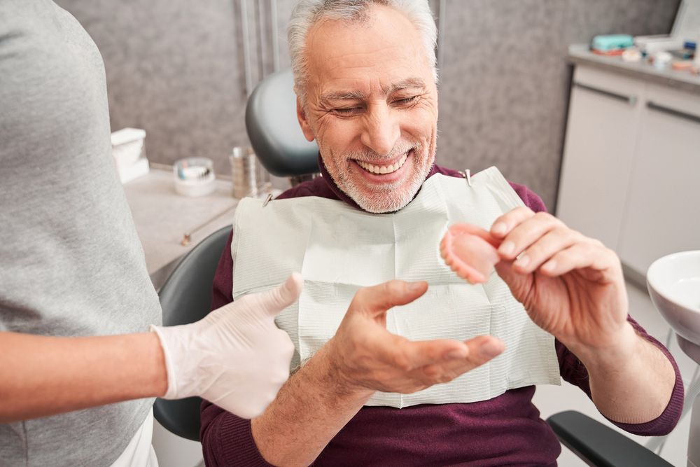 Man Getting Proper Denture Fit in A Clinic