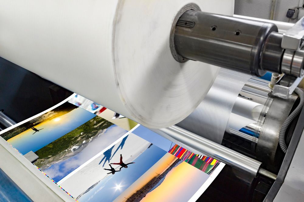 Machine is Printing Pictures on a Roll of Paper — Classic Design & Print in Svensson Heights, QLD