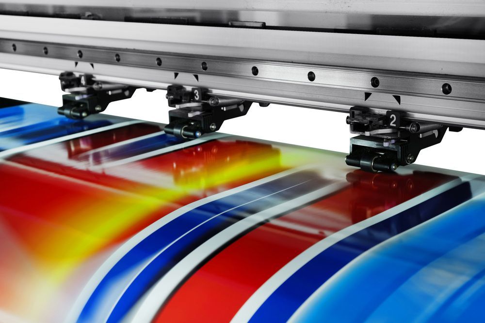 Machine is Printing a Colourful Image on a Piece of Paper — Classic Design & Print in Svensson Heights, QLD