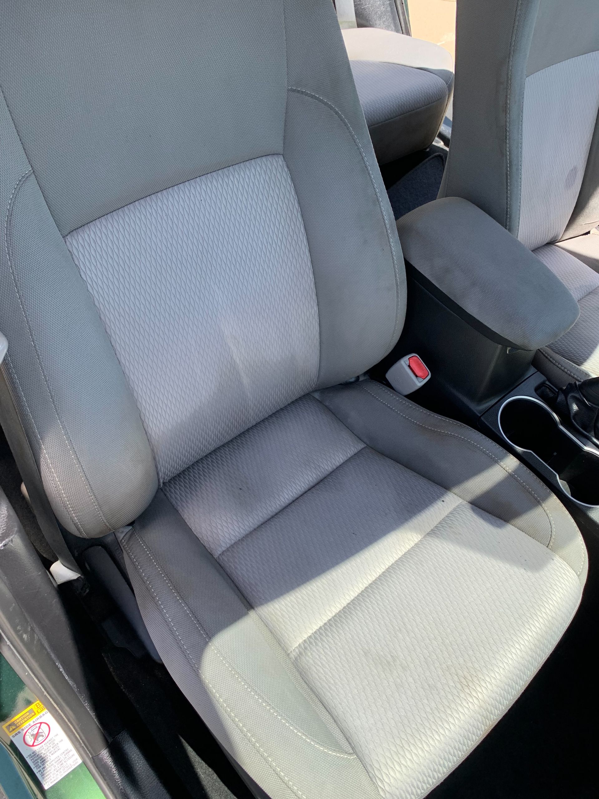 A close up of a car seat in a car.