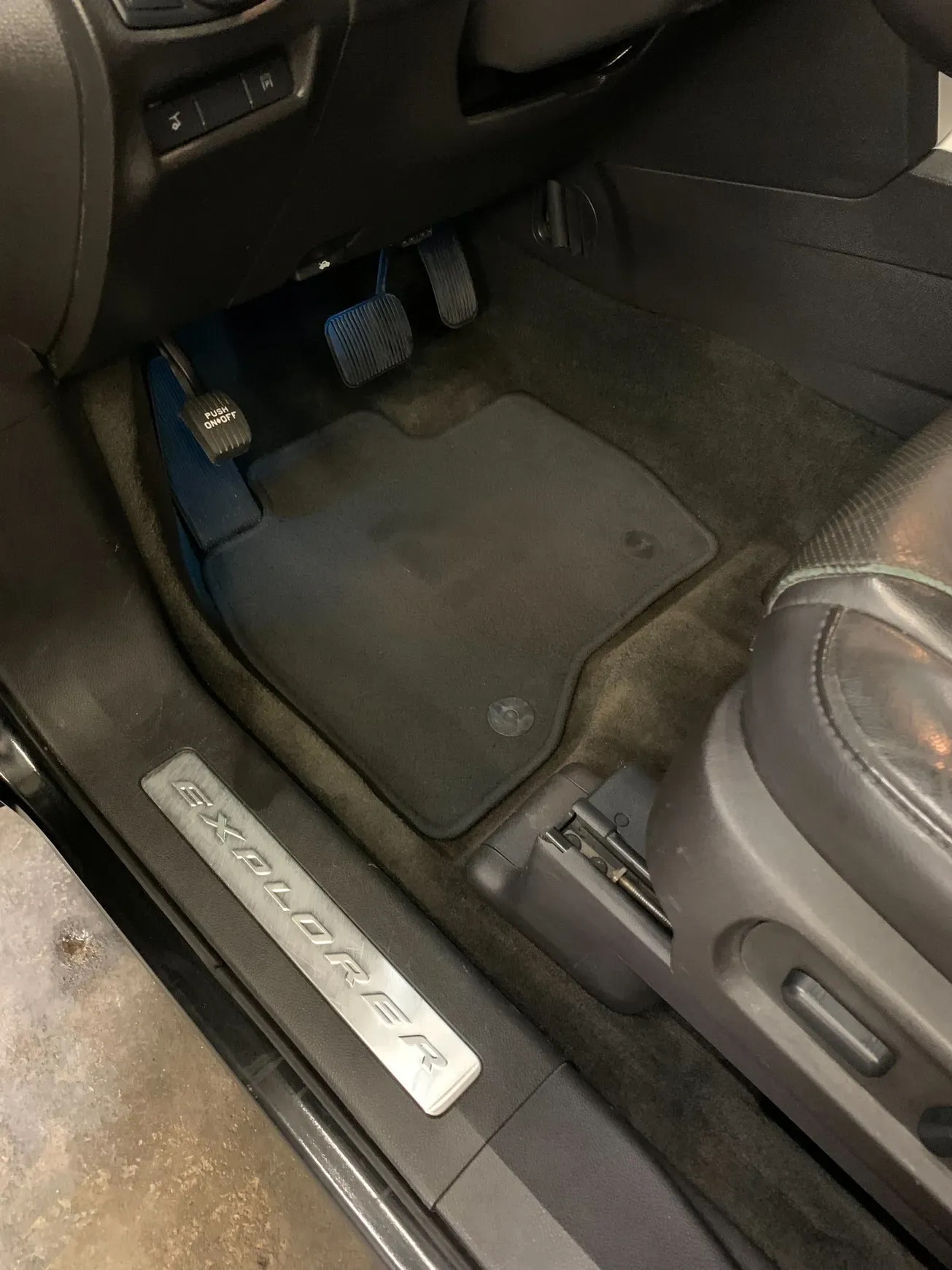 A close up of the inside of a car with the door open.