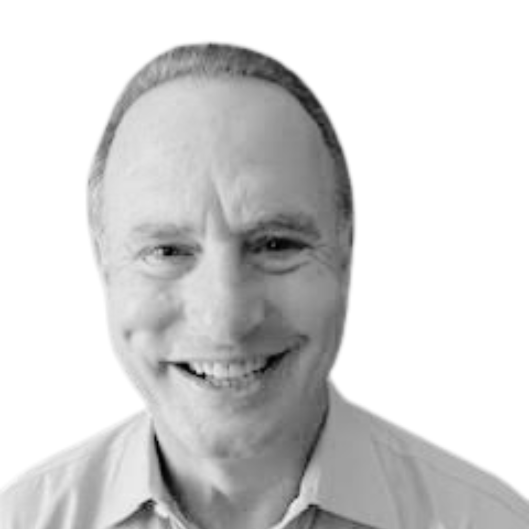 Smiling bald man in a light shirt against a plain white background