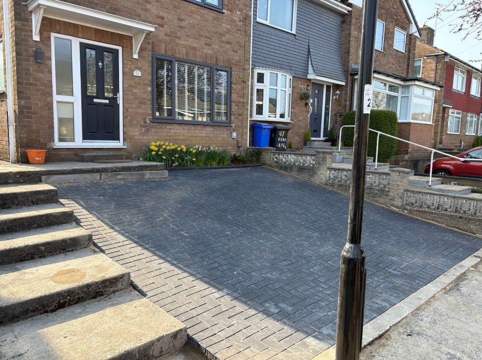 Charcoal block paving driveway with buff paver edging installed in Rotherham
